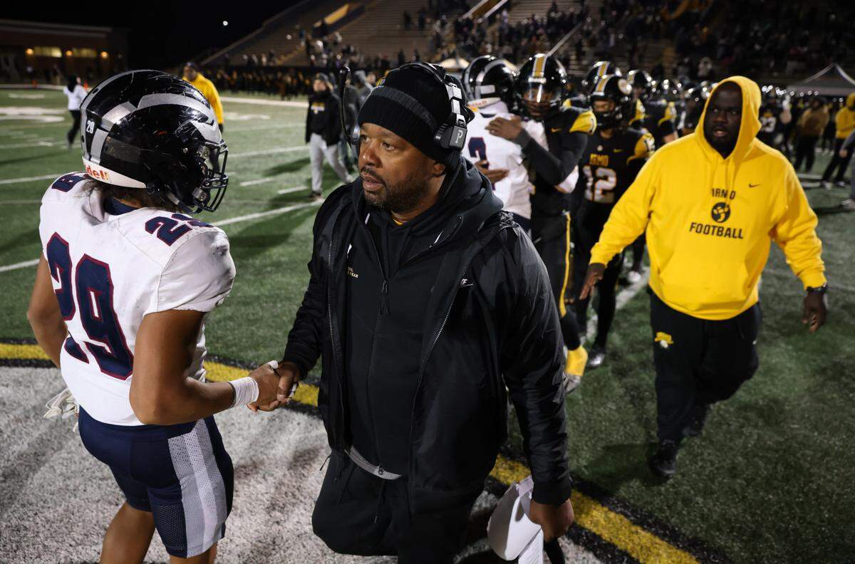 Head coach Aaron Brand of Irmo shakes hands with White Knoll players following Irmo’s game against White Knoll in their Class 5A Division II semifinal game in Irmo on Friday, December 6, 2024.