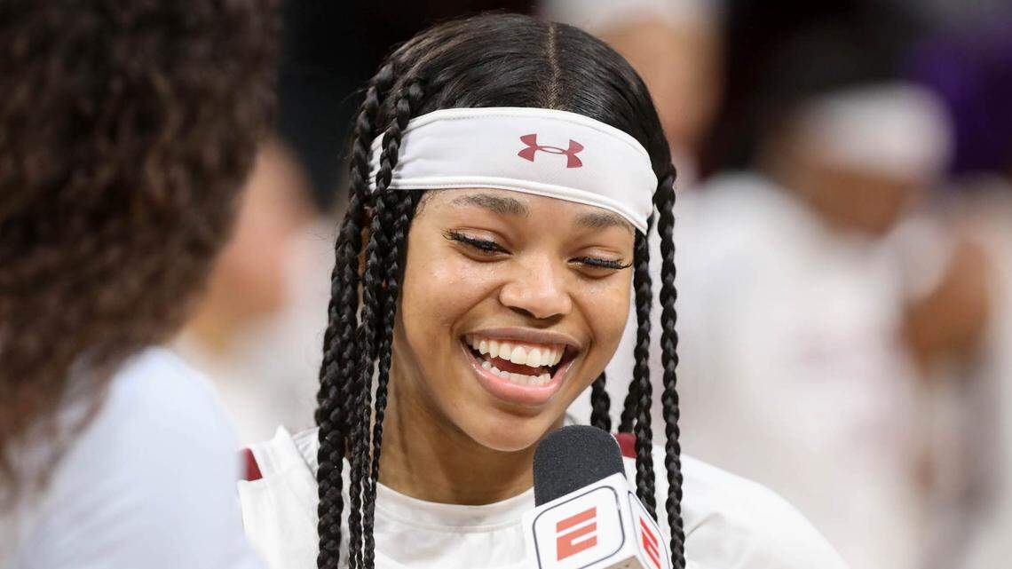 South Carolina’s Destanni Henderson (3) is all smiles while being interviewed for ESPN after the Gamecocks beat Stanford  on Tuesday, Dec. 21, 2021 in the Colonial Life Arena. Carolina beat Stanford, 65-61.