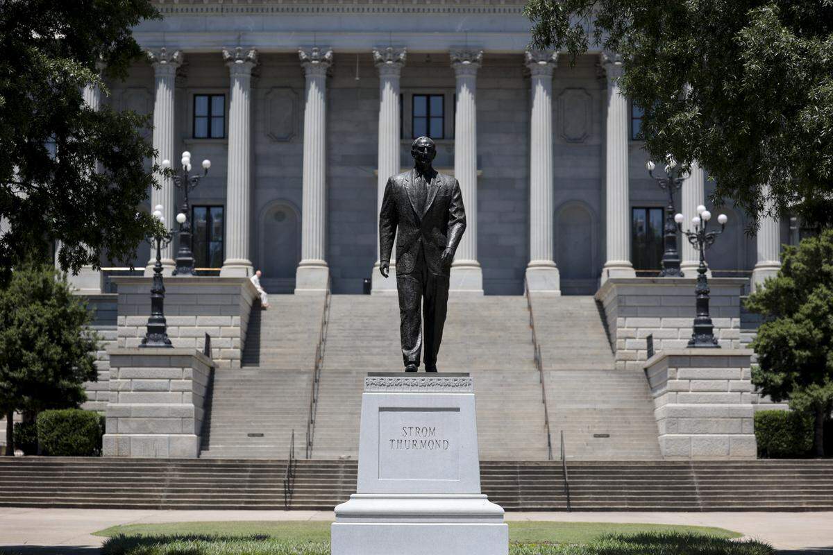 The statue honoring Strom Thurmond on the South Carolina State House grounds. The inscription on the statue was amended in 2005 to add the name of a fifth child, Essie Mae Washington-Williams.