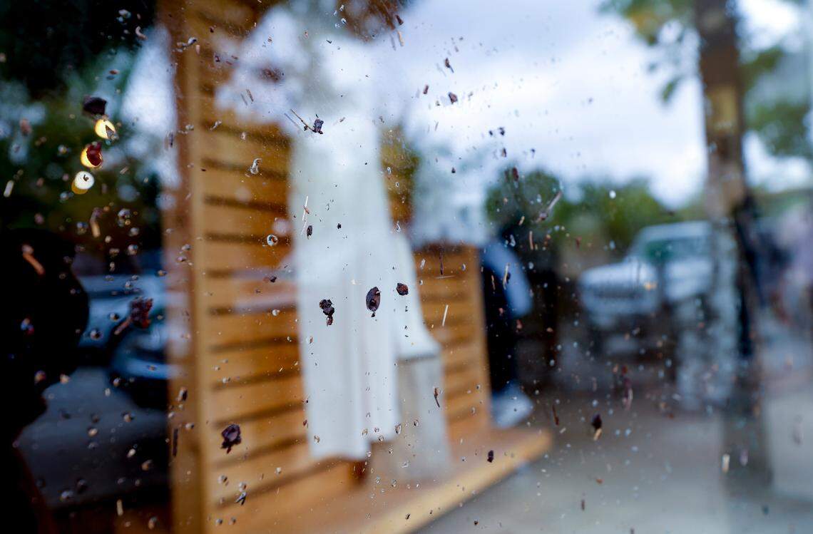 Debris spread by floodwaters measured as high as 44 inches from the sidewalk on the storefront window of Corbeau in Columbia’s Five Points business district. The district was inundated by flood waters after an unprecedented rain event on Monday, July 4, 2022.