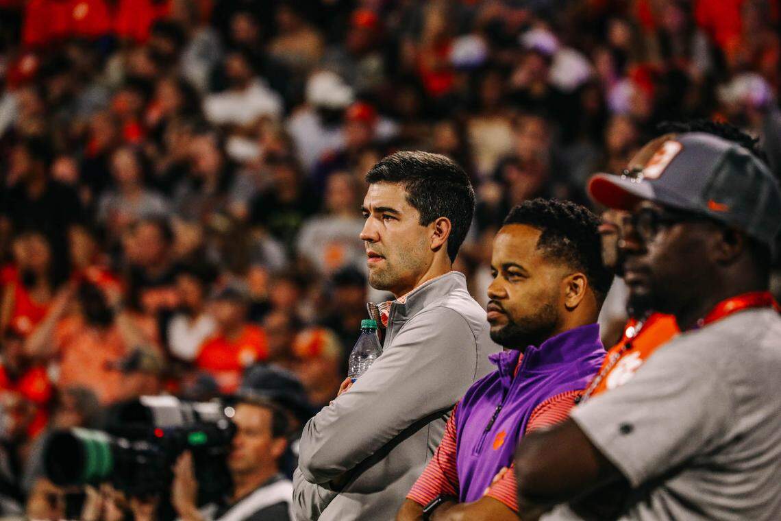 Clemson athletic director Graham Neff (far left) and deputy athletic director Kevin White (middle) at a Tigers football game
