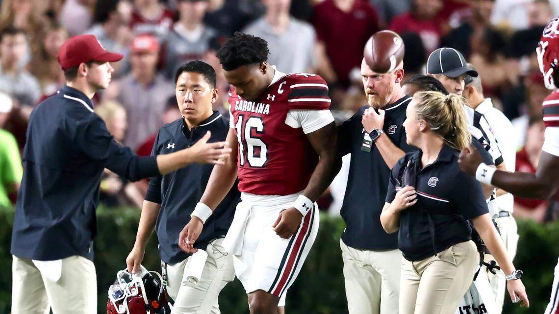 South Carolina quarterback LaNorris Sellers is helped off the field Saturday in the second quarter of the Gamecocks’ game against Vanderbilt.