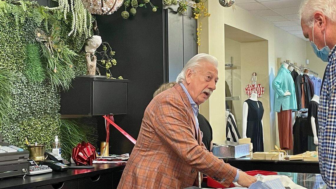 A fixture in Columbia’s clothing scene for more than 60 years, Leonard Fabrizio makes a sale at Brittons on Devine Street.