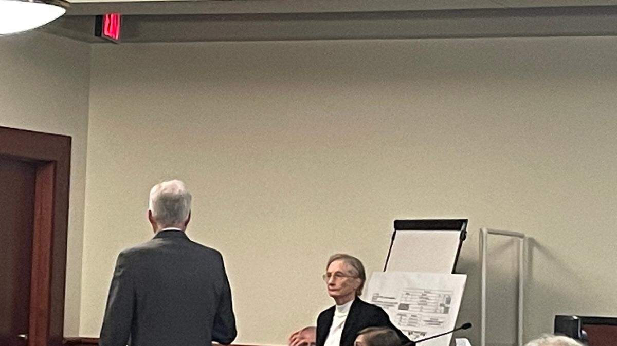Prosecutor Shawn Graham (left) and Dr. Janice Ross explain to jurors how a bullet went through the body of William Player Holland, who Adam Lazzarini is accused of shooting. Ross did the autopsy on Holland.