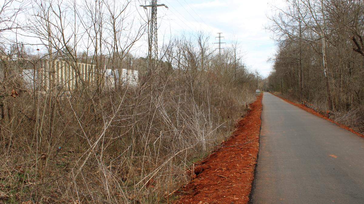 The Swamp Rabbit Trail, a popular hiking path in the Upstate, runs past Carolina Plating Works, seen on the left. The industrial site has groundwater contamination.