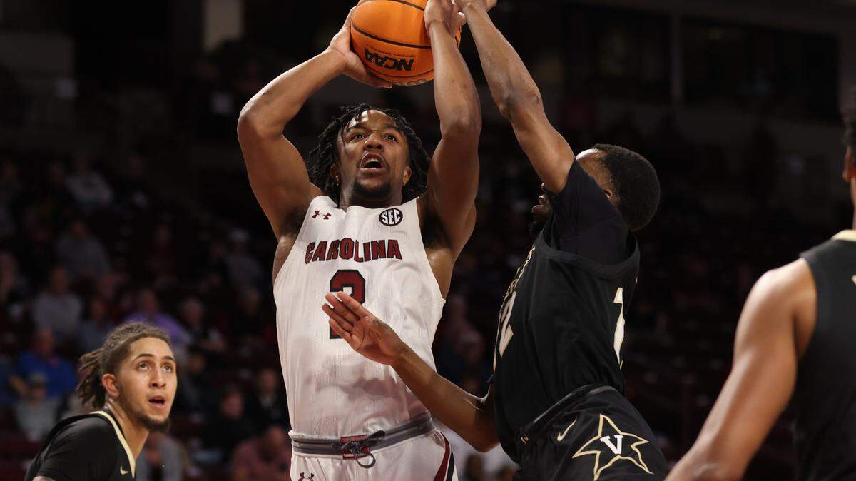 South Carolina Gamecocks guard Chico Carter Jr. (2) goes up for a shot over Vanderbilt Commodores guard Trey Thomas (12) during South Carolina’s game against visiting Vanderbilt at Colonial Life Arena in Columbia on Tuesday, February 14, 2023.