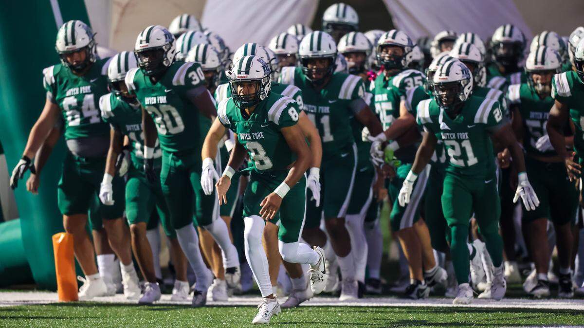 Dutch Fork Silver Foxes wide receiver Jayden Westbrook (8) leads his teammates onto the field before the game against the Weddington Warriors at Dutch Fork High School Friday, Sept. 22, 2023.