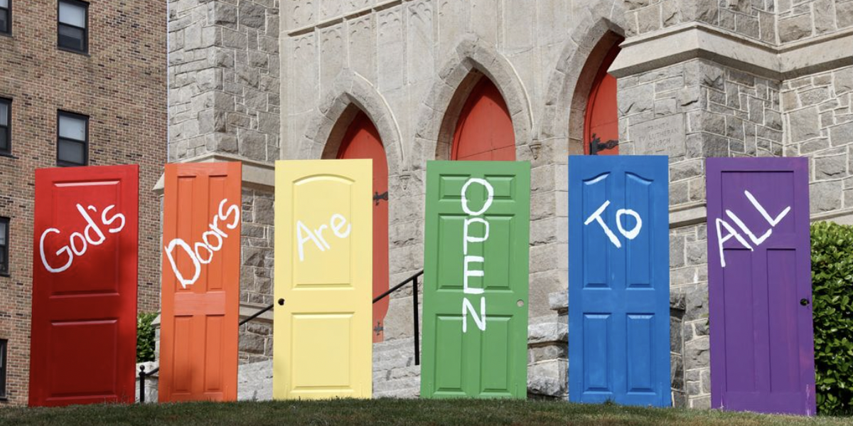 Trinity Lutheran temporarily placed doors on the top steps to the church saying God’s Doors Are Open To All.