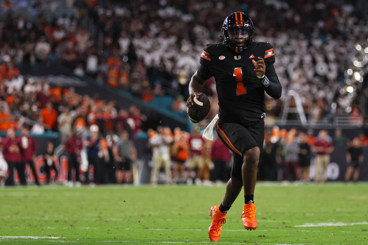 Miami quarterback Cam Ward (1)