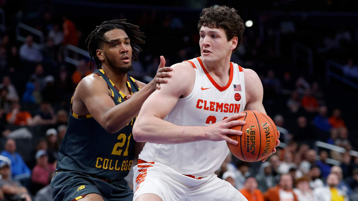 Mar 13, 2024; Washington, D.C., USA; Clemson Tigers center PJ Hall (24) drives to the basket as Boston College Eagles forward Devin McGlockton (21) defends in the second half at Capital One Arena.