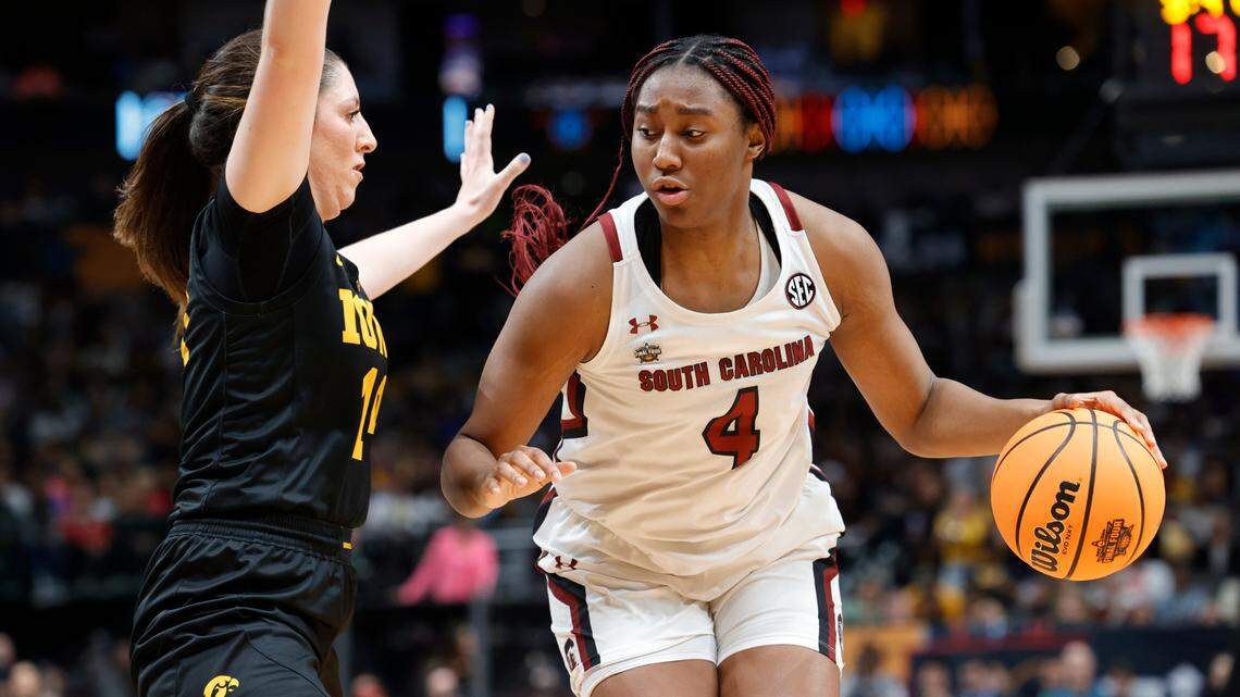 South Carolina Gamecocks forward Aliyah Boston (4) is guarded by Iowa Hawkeyes forward McKenna Warnock (14) in the NCAA Tournament Final Four game at the American Airline Center on Friday, March 31, 2023.