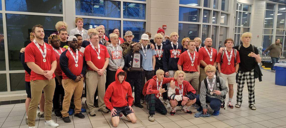 Lugoff-Elgin wrestlers pose for a photo after Saturday’s Class 4A state championship match.