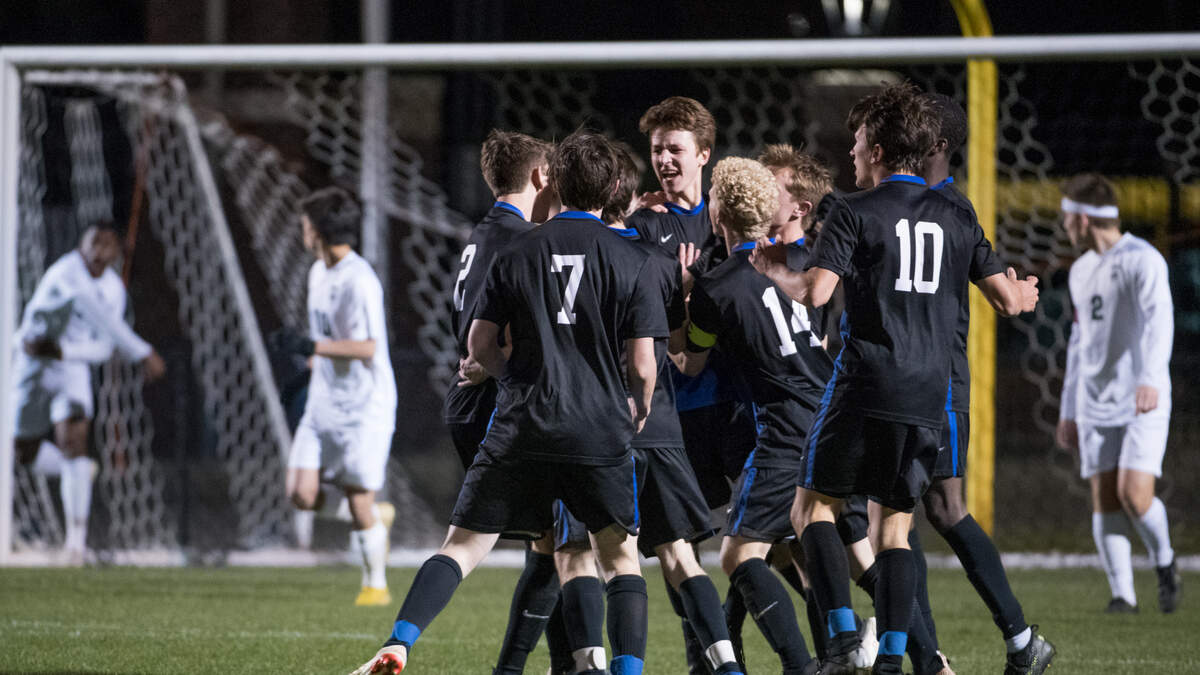 Lexington players celebrate their winning goal in overtime against Dutch Fork Tuesday, March 19, 2019, in Lexington, S.C. 
