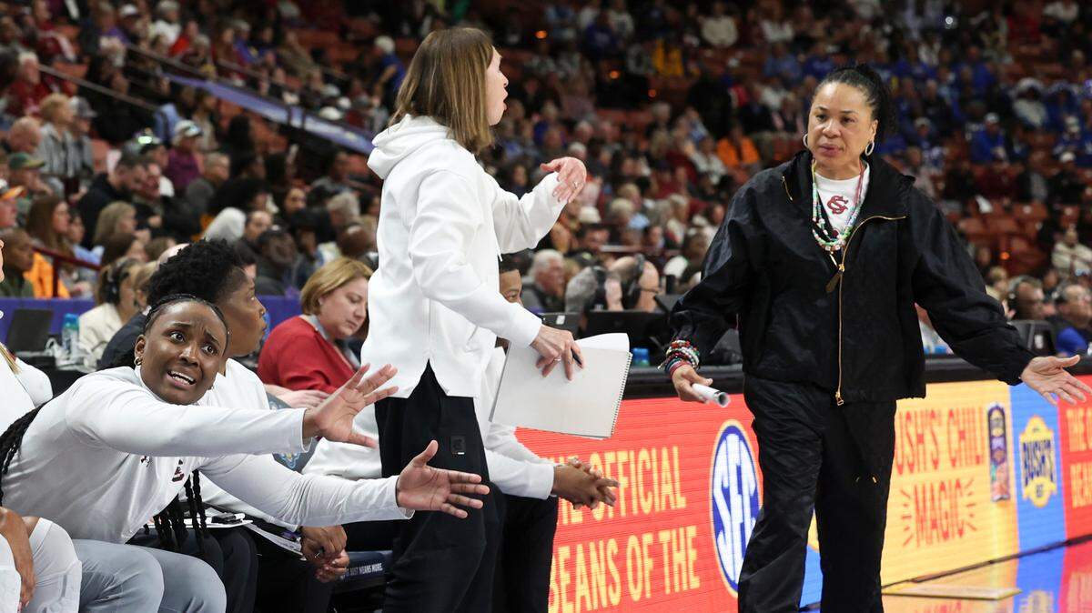 University of South Carolina Assistant Coach Khadijah Sessions, Associate Coach Lisa Boyer and Head Coach Dawn Staley react to a call during the second half of action against Vanderbilt in the SEC Tournament at the Bon Secours Wellness Arena in Greenville on Friday, Mar. 7, 2025.