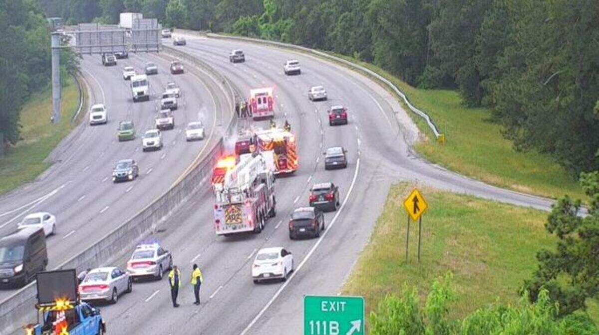 Lanes on a highway are closed as emergency responders deal with a vehicle fire.