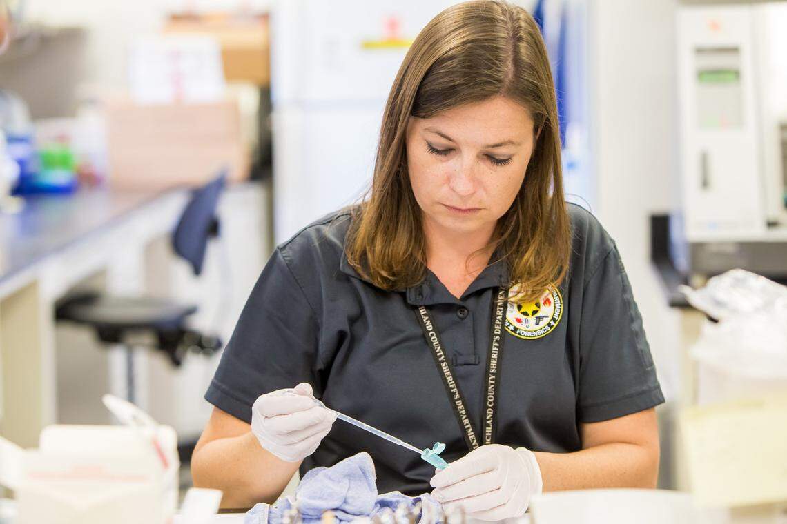 Serologist Ashleigh Dixon examines an undergarment in a sexual assault case at the Richland County Sheriff’s Department DNA Lab.