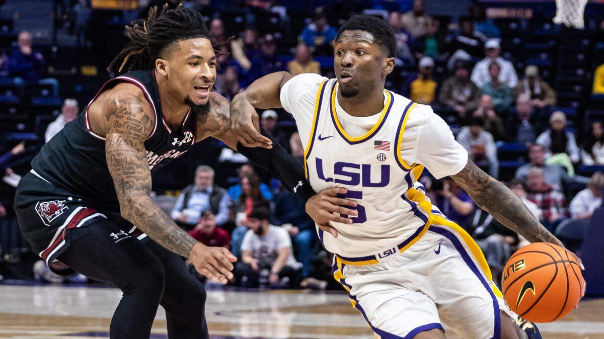 LSU Tigers guard Cam Carter (5) dribbles against South Carolina Gamecocks guard Jamarii Thomas (6) during their game at Pete Maravich Assembly Center.