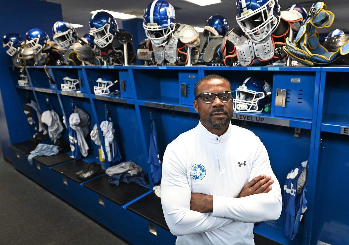 Former Carolina Panthers wide receiver Jerricho Cotchery inside the Limestone football locker room in February.