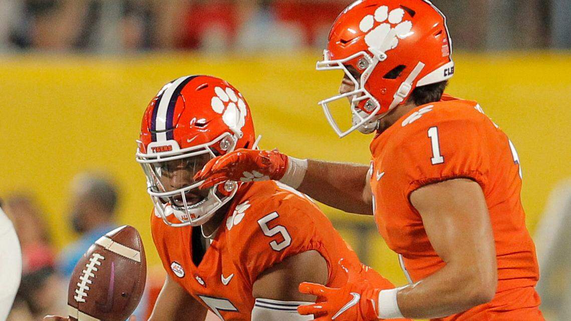 Clemson quarterback D.J. Uiagalelei (5) loses control of the ball after a bad snap as running back Will Shipley has to stall for the play against Georgia during the Duke’s Mayo Classic in Charlotte, N.C. on Saturday, Sept. 4, 2021.