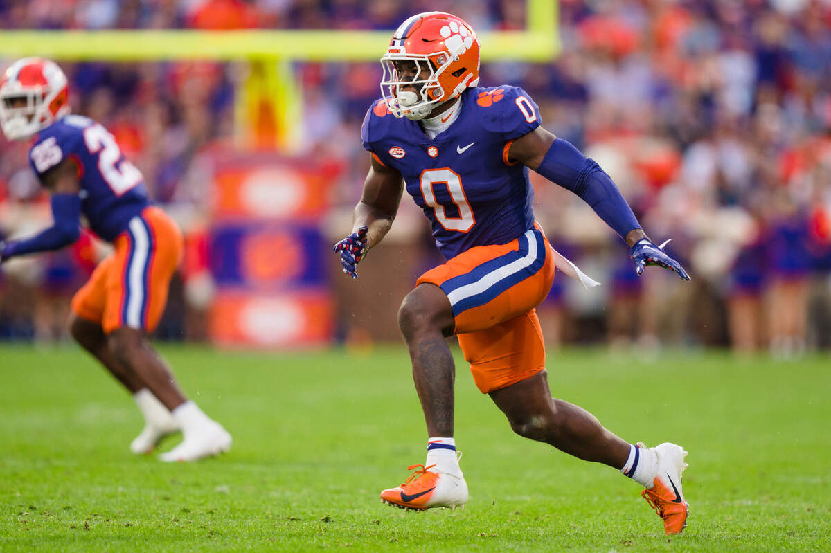 Clemson linebacker Barrett Carter (0) plays against Louisville during an NCAA college football game on Saturday, Nov. 12, 2022, in Clemson, S.C. (AP Photo/Jacob Kupferman)