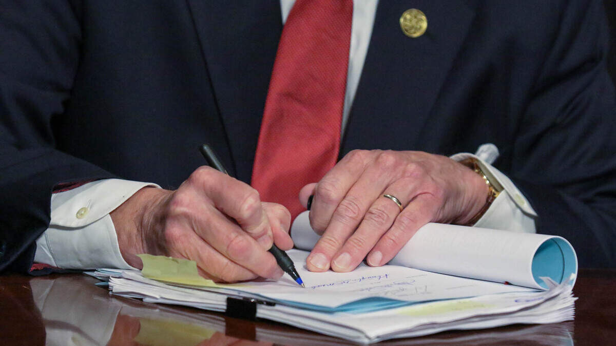 South Carolina Gov. Henry McMaster signs the fetal heartbeat bill into law during a ceremony at the Statehouse on Thursday, Feb. 18, 2021.