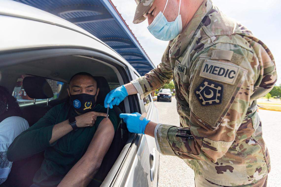 Travis Jennings receives the coronavirus vaccine at W.A. Perry Middle School on Saturday, May 22, 2021. Jennings works in Orangeburg’s public schools and wanted to protect himself and his family from the virus.