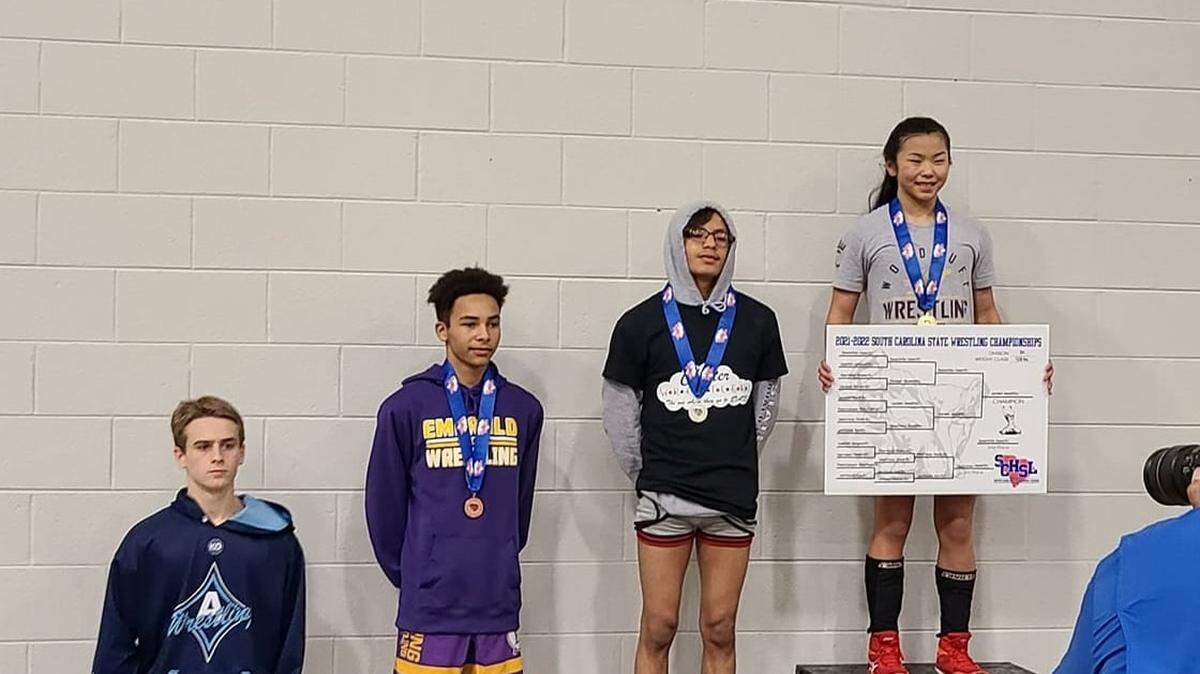 Woodruff’s June Welch, far right, became the first female wrestler to win SC High School League individual state championsip on Saturday, Feb. 26, 2022.