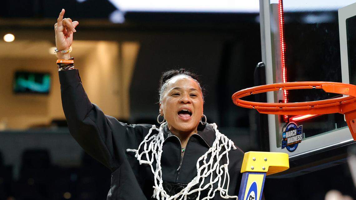 University of South Carolina Head Coach Dawn Staley celebrates winning the Albany Regional and advancing to the Final Four after cutting a piece of the net at the MVP Arena in Albany, New York on Sunday, March 31, 2024.
