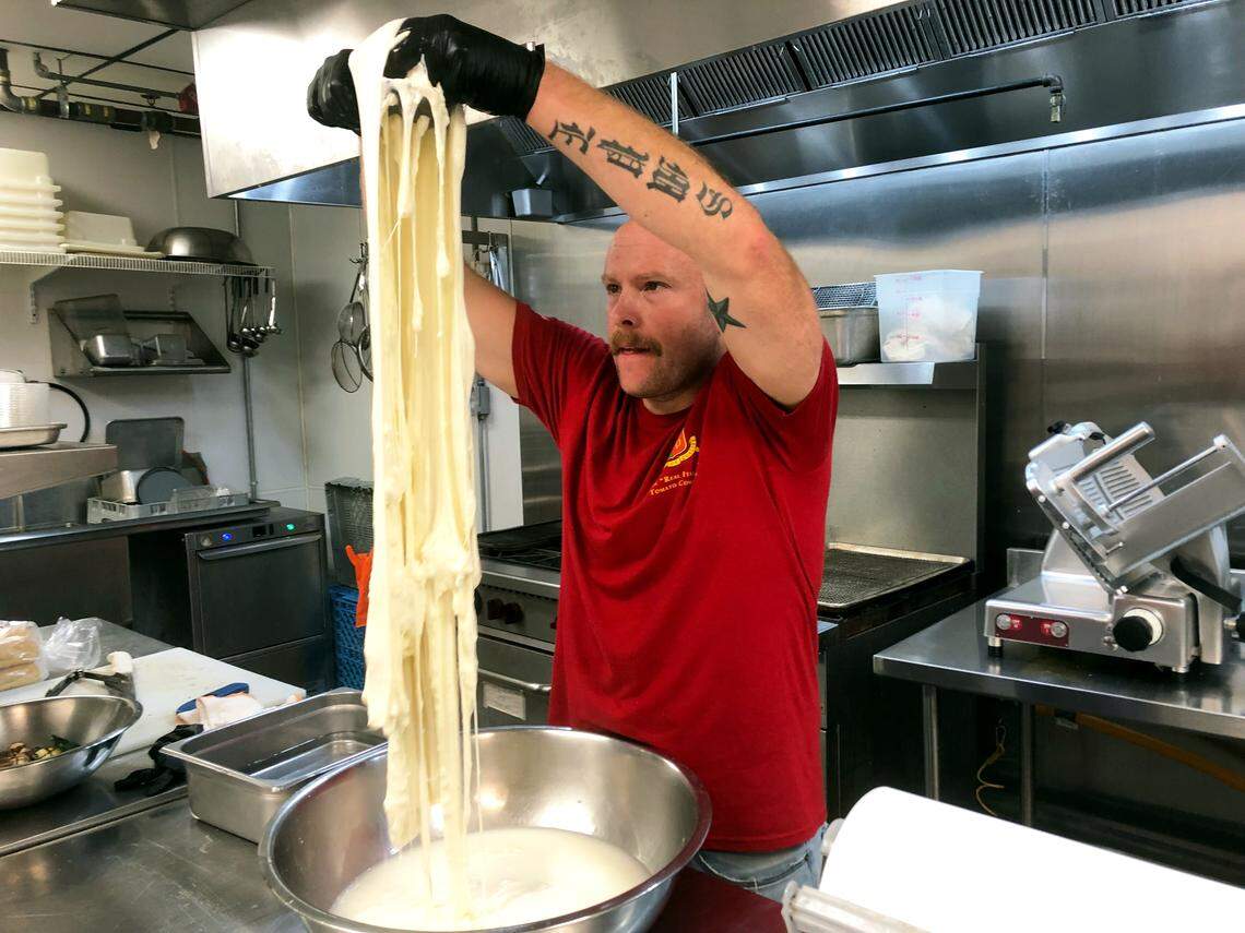 Joe Cardinale at Enzo’s Delicatessen makes mozzarella. The sandwich shop recently moved in with the owners’ Italian market, Alimentari Don Luigi.