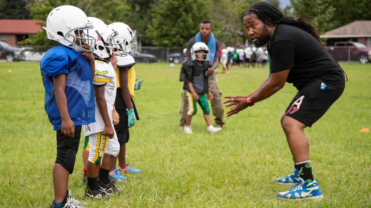 The Greenview Eagles six-year-old team practices football at the former W.G. Sanders Middle School in Columbia, South Carolina on Thursday, July 7, 2022.