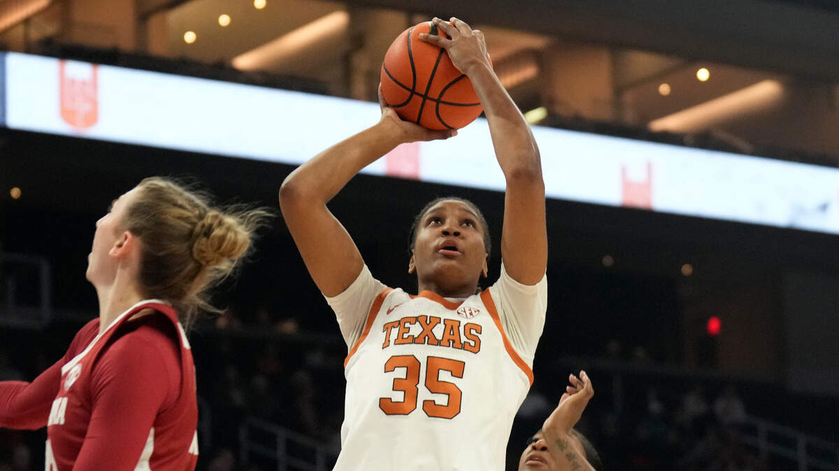 Texas Longhorns forward Madison Booker (35) shoots over Alabama Crimson Tide guard Karly Weathers (22) during the first half at Moody Center.