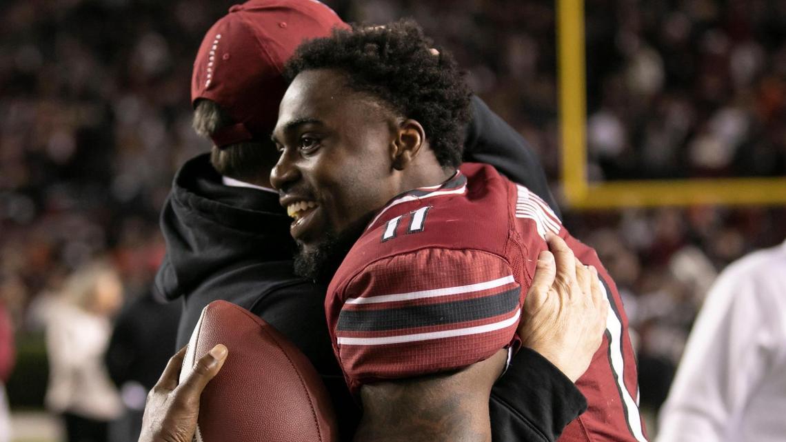 ZaQuandre White gets a hug from coach Shane Beamer while being recognized on senior night before the Gamecocks’ game against Clemson at Williams-Brice Stadium on Saturday, November 27, 2021.