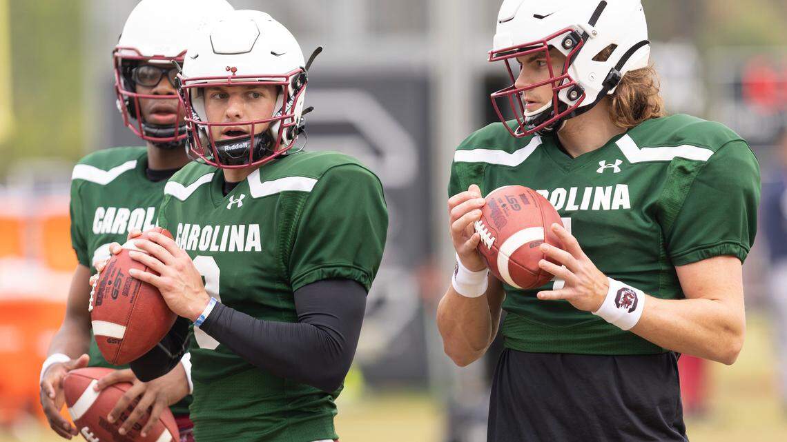 South Carolina quarterbacks Luke Doty (9) and Colten Gauthier (4) warm up during the Gamecocks’ practice in Columbia on Thursday, March 23, 2023.