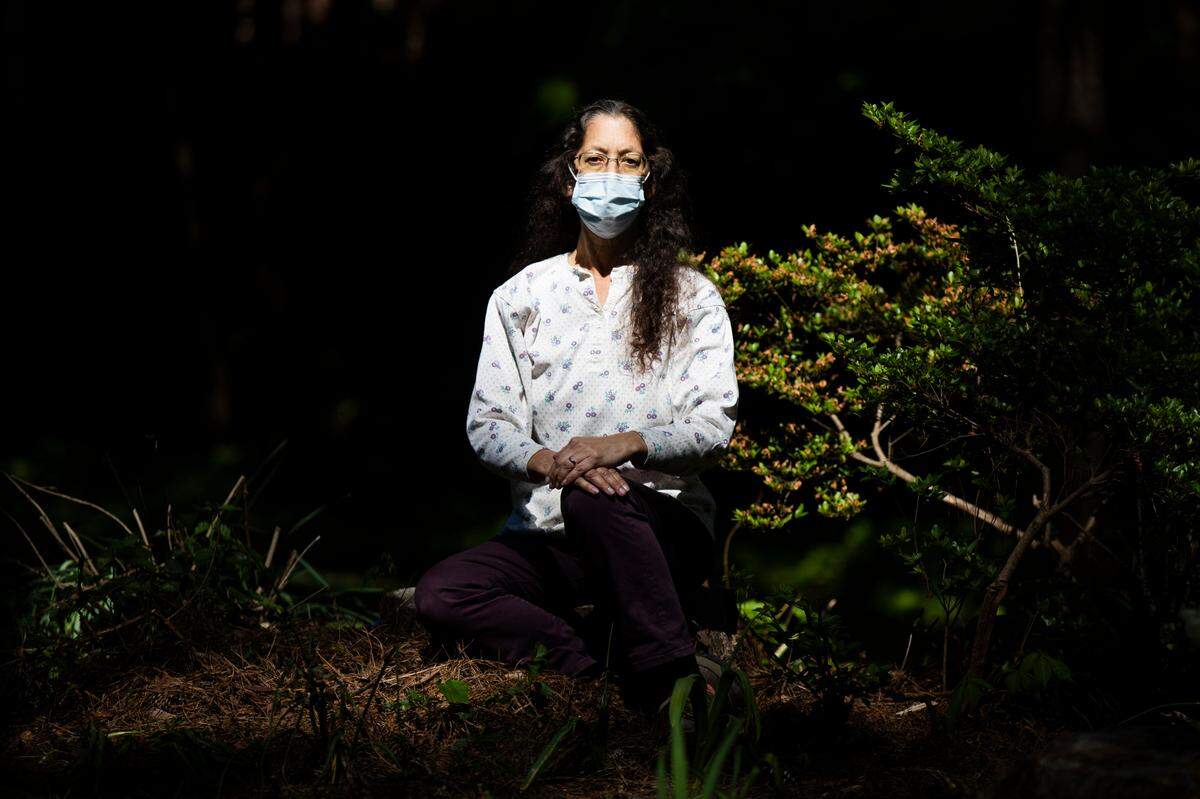 Maris Burton poses for a portrait outside her home on Thursday, April 2, 2020. Burton’s fiancé, Tim Liszewski, died of the coronavirus, and she believes because of her close contact and symptoms, that she has it as well.