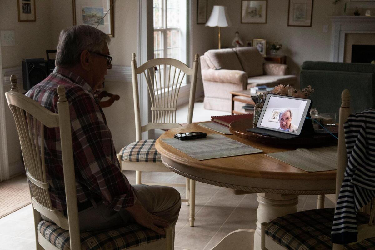 Nora Schafer speaks with her husband Ulrich Schafer over FaceTime video chat in Lexington, South Carolina on Thursday, February 4, 2021. The couple have both received the coronavirus vaccine, but still mostly talk over video chat due to restrictions in place because of the coronavirus pandemic.