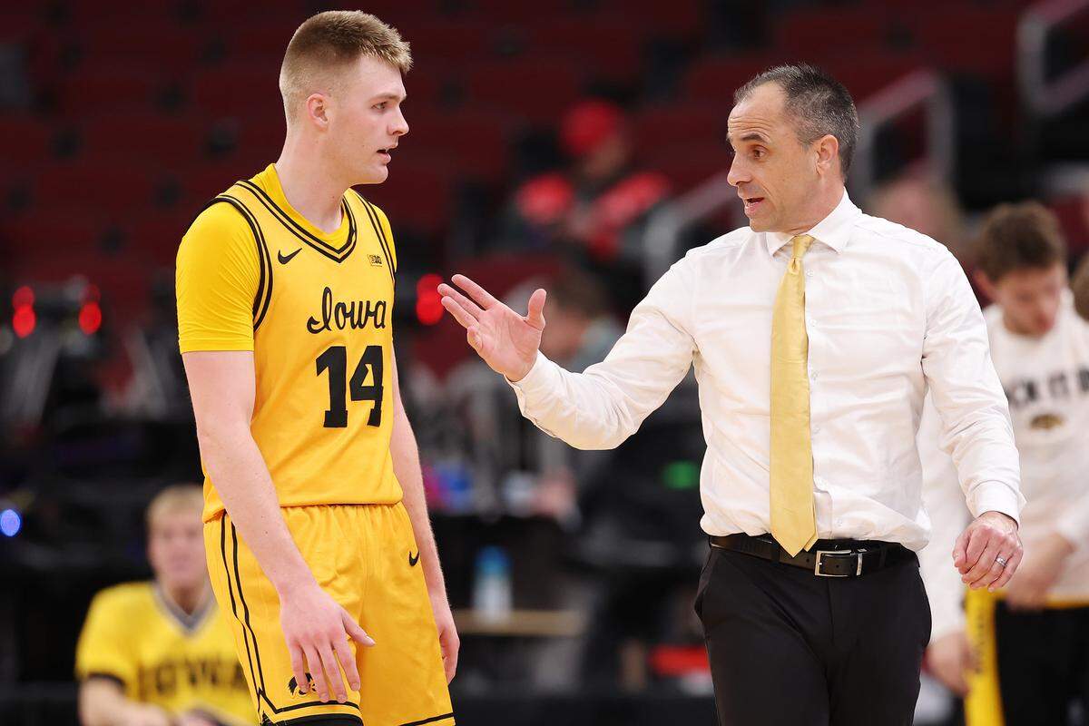 CHICAGO, ILLINOIS - MARCH 11: Head coach Ben McCollum of the Iowa Hawkeyes talks with Bennett Stirtz #14 against the Maryland Terrapins in the second half during the second round of the 2026 Big Ten Men's Basketball Tournament at the United Center on March 11, 2026 in Chicago, Illinois. (Photo by Michael Reaves/Getty Images)