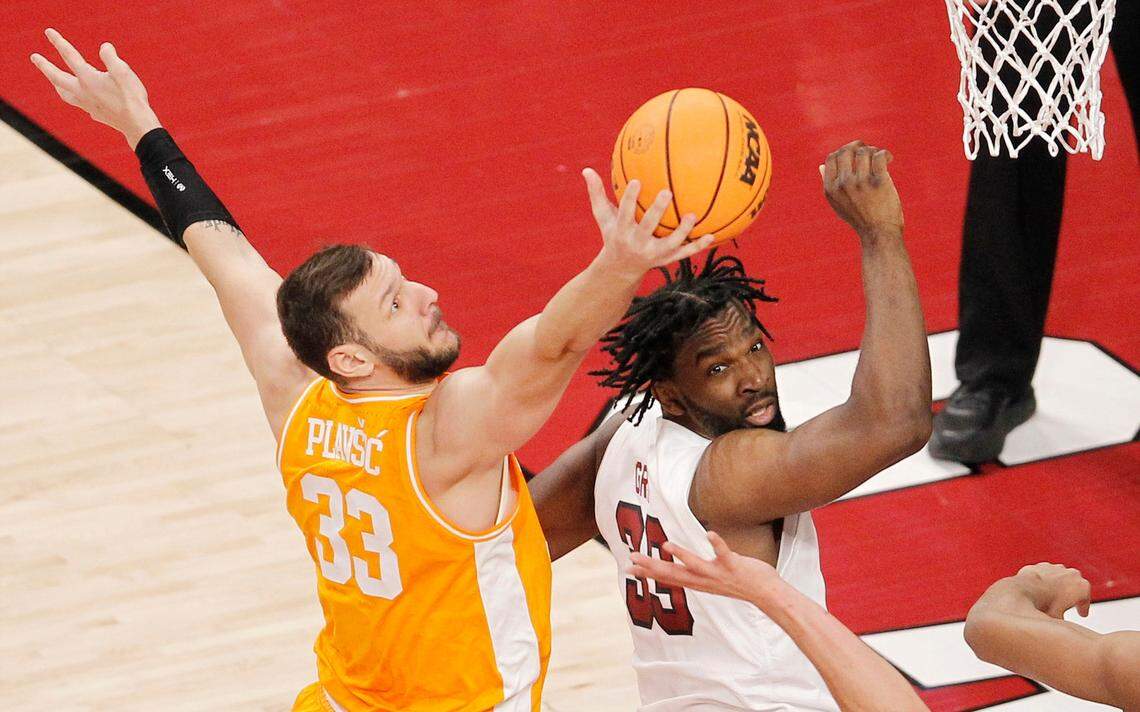 Tennessee forward Uros Plavsic (33) grabs a rebound over South Carolina forward Josh Gray (33) during first-half action in Columbia, S.C. on Saturday, Jan. 7, 2023.