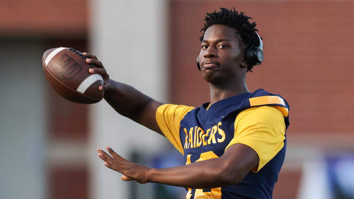 Cam McMillon of Keenan throws a football along the sideline before Keenan’s game against Swansea in Columbia on Friday, October 3, 2025.