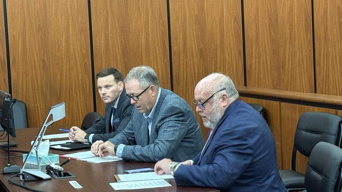 Former SC banker and convicted fraudster Russell Laffitte sits between two of his defense lawyers, Michael Parente (left) and Mark Moore at Monday’s sentencing hearing. 