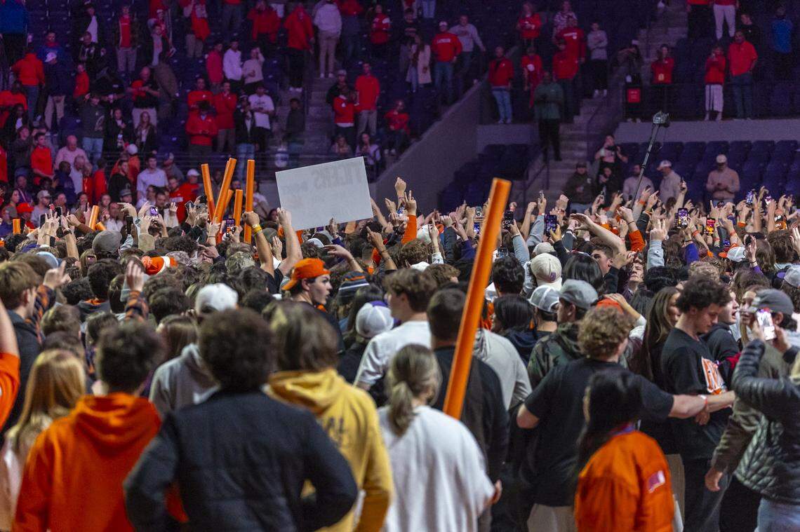 Clemson fans storm the court following Clemson’s victory over Kentucky during a game at Littlejohn Coliseum in Clemson, S.C., on Tuesday, Dec. 3, 2024.