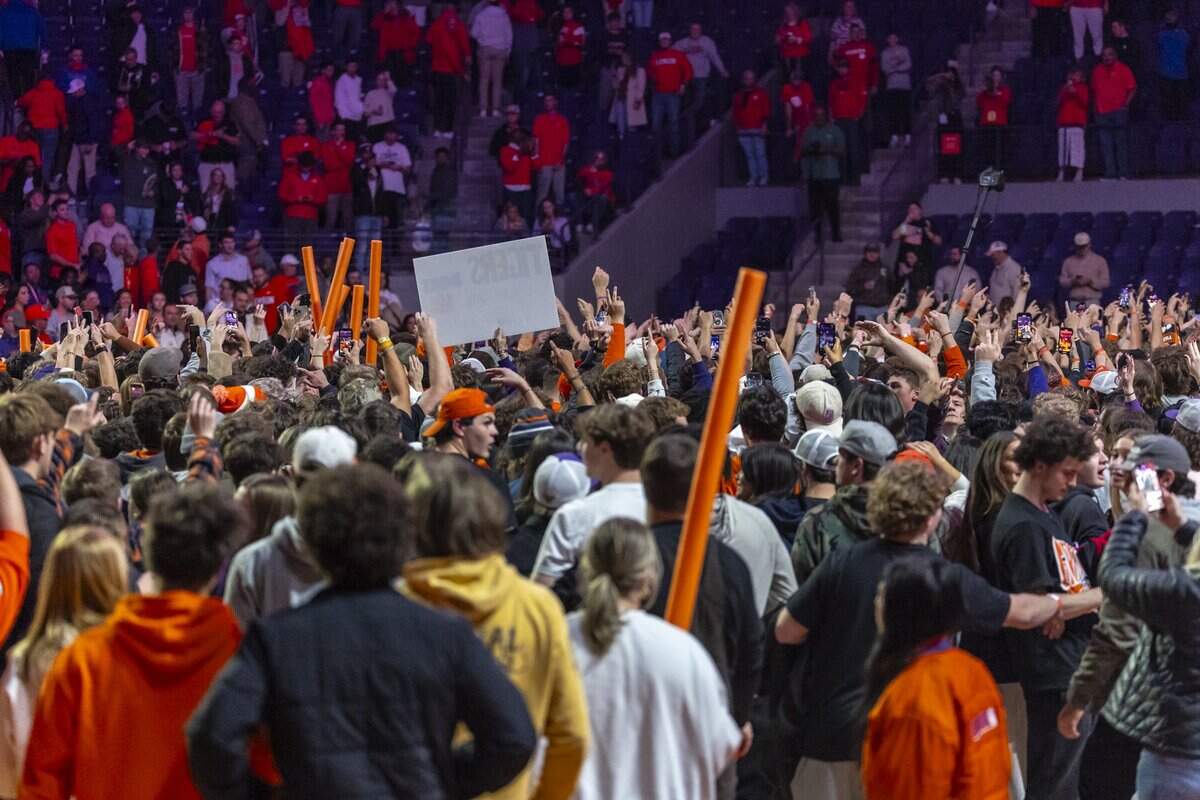 Clemson fans storm the court following Clemson’s victory over Kentucky during a game at Littlejohn Coliseum in Clemson, S.C., on Tuesday, Dec. 3, 2024.