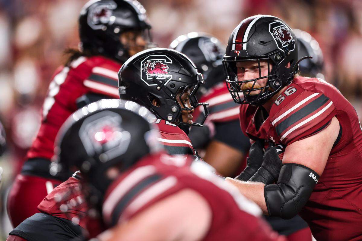 South Carolina offensive linemen Shedrick Sarratt Jr. (72) and Mac Walters (66) warm up before the Gamecocks’ game against South Carolina State on Sept. 6.