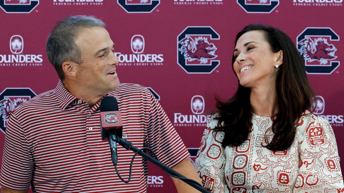 University of South Carolina football coach Shane Beamer and his wife Emily enjoy a moment while announcing donations through the Beamer Family Foundation to Forest Lake, Jackson Creek, Joseph Keels and L.W. Conder Elementary Schools.