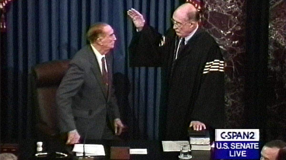 Senate President Pro Tempore Strom Thurmond, R-S.C., left, swears in Chief Justice William H. Rehnquist, shown in this image from video, Thursday, Jan. 7, 1999, in Washington. Rehnquist presided over the impeachment trial of President Clinton. (AP Photo/CSPAN)