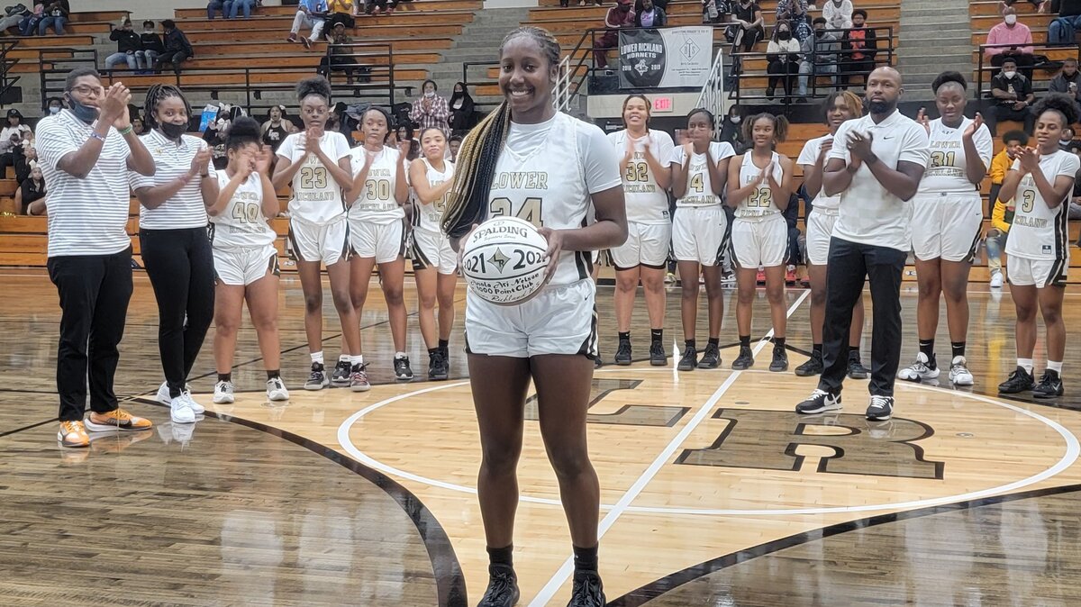 Lower Richland’s Anala Nelson gets honored Friday night for scoring her 1,000th career point earlier this season.