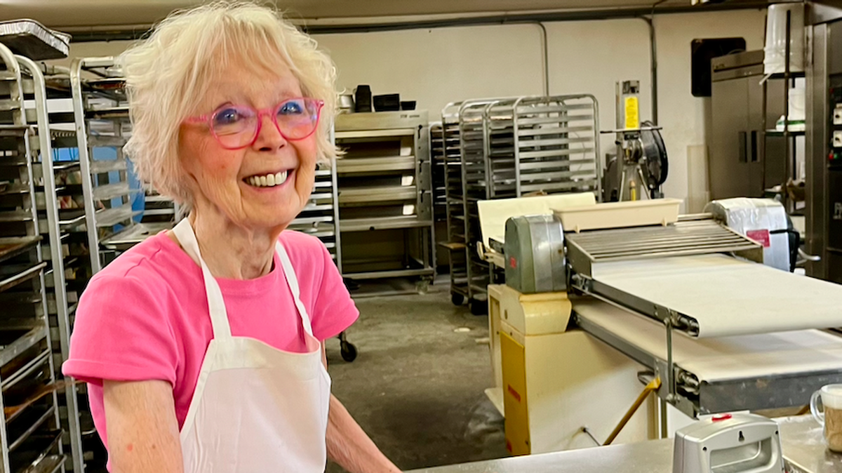 Signe Gardo poses in the Hilton Head Island bakery where, after 50 years, she still works 10-hour days, six days a week.