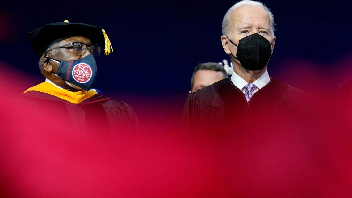 President Joe Biden attends the South Carolina State University’s 2021 Fall Commencement Ceremony in Orangeburg, S.C., Friday, Dec. 17, 2021, with Rep. Jim Clyburn, D-S.C., left. (AP Photo/Carolyn Kaster)