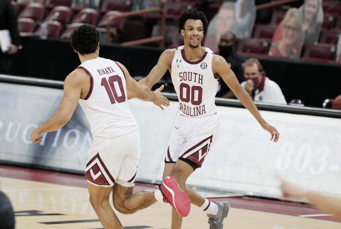 South Carolina Gamecocks forward Justin Minaya (10) congratulates South Carolina Gamecocks guard AJ Lawson (00) during their game against Texas A&M at Colonial Life Arena on Wednesday, January 6, 2021.