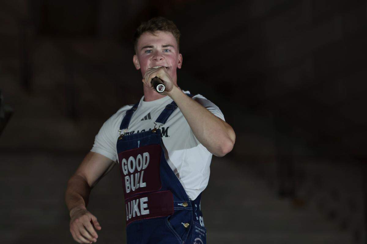 Yell leaders lead Texas A&M fans in the Aggie Yell practice in front of the South Carolina State House on Friday, Nov. 1, 2024. The Gamecocks face the Aggies Saturday at Williams-Brice Stadium.