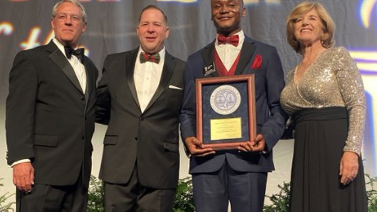From left, Max Metcalf of BMW, South Carolina Public Charter School District Superintendent Chris Neeley, 2023 South Carolina Teacher of the Year Deion Jamison, and State Superintendent of Education Molly Spearman after Jamison was announced as Teacher of the Year.